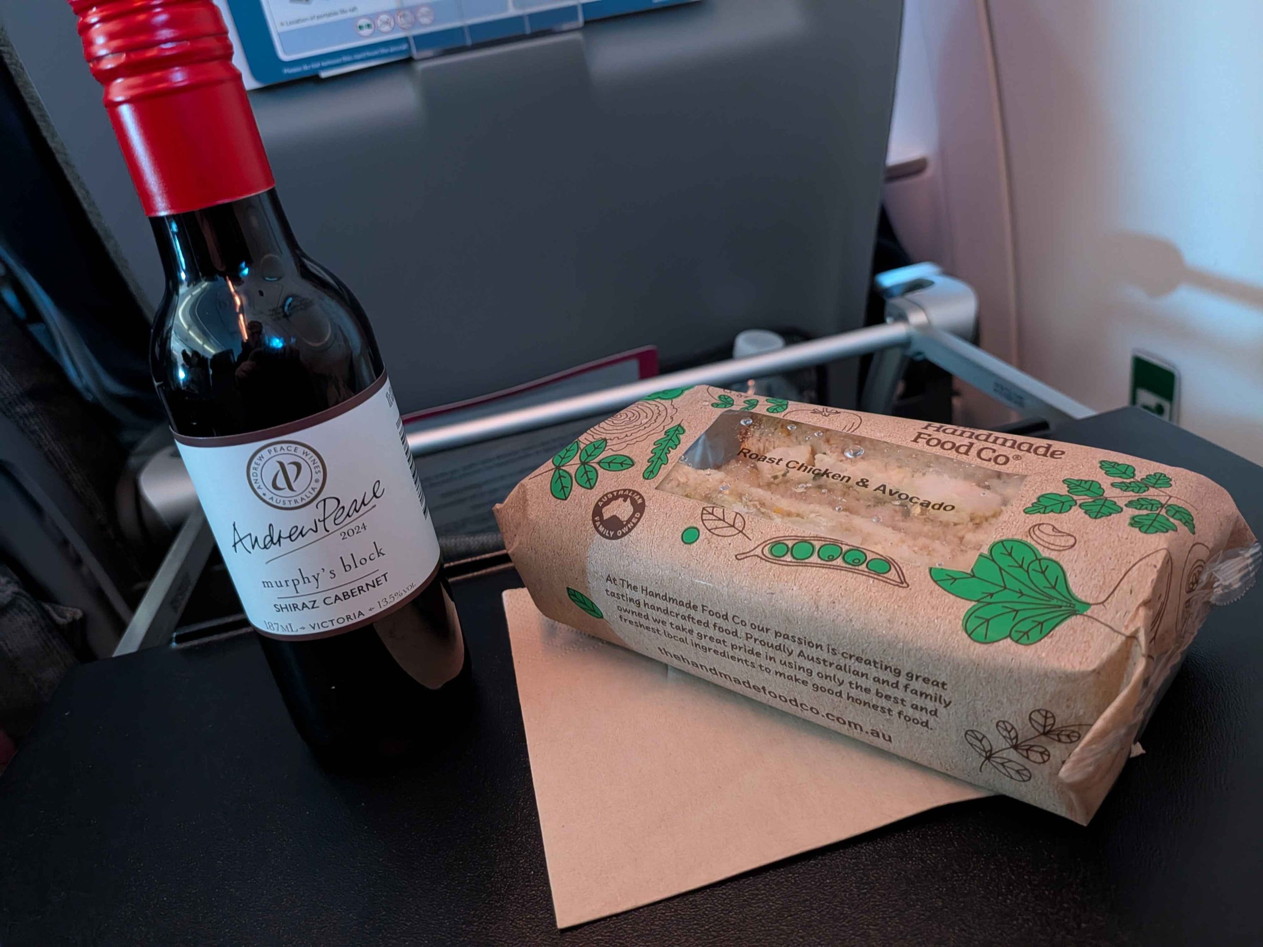 Andrew Peace Shiraz Cabernet and Handmade Food Co Roast Chicken Avocado sandwich on Qantas