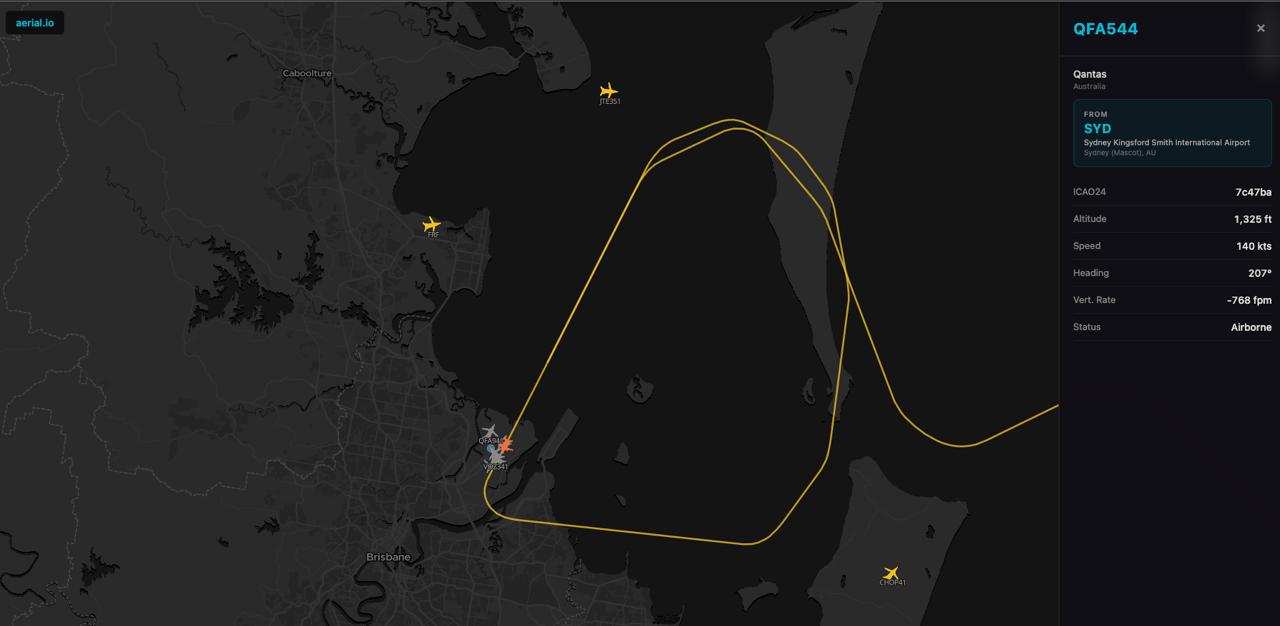 Flight tracker showing QFA544 go-around loop over Moreton Bay approaching Brisbane