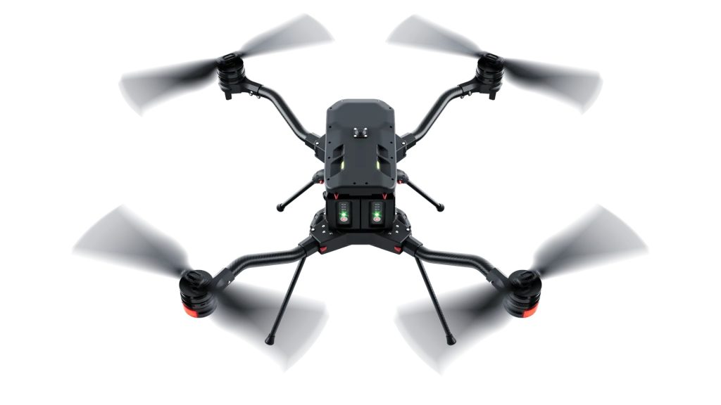 Harris Aerial H4C Quad compact heavy-lift drone showing folded airframe and quick-release payload bay