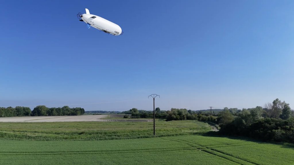 HyLight autonomous hydrogen-powered airship flying over transmission lines